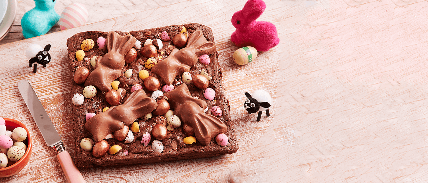 a delicious chocolate brownie topped with colorful mini chocolate easter eggs