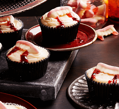 vampire bite cupcakes served on vampire theme based decorated table